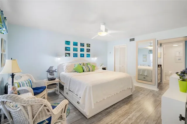 a bedroom with a bed and a cabinets