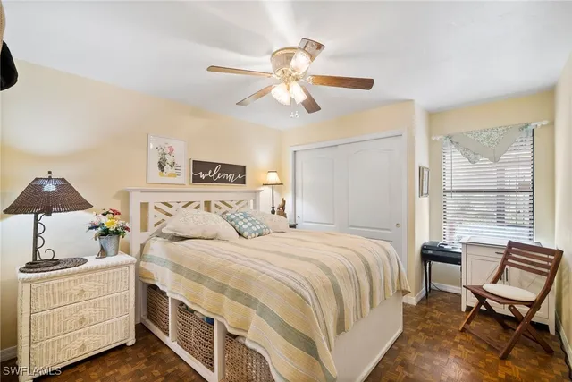 a bedroom with a bed and a chair