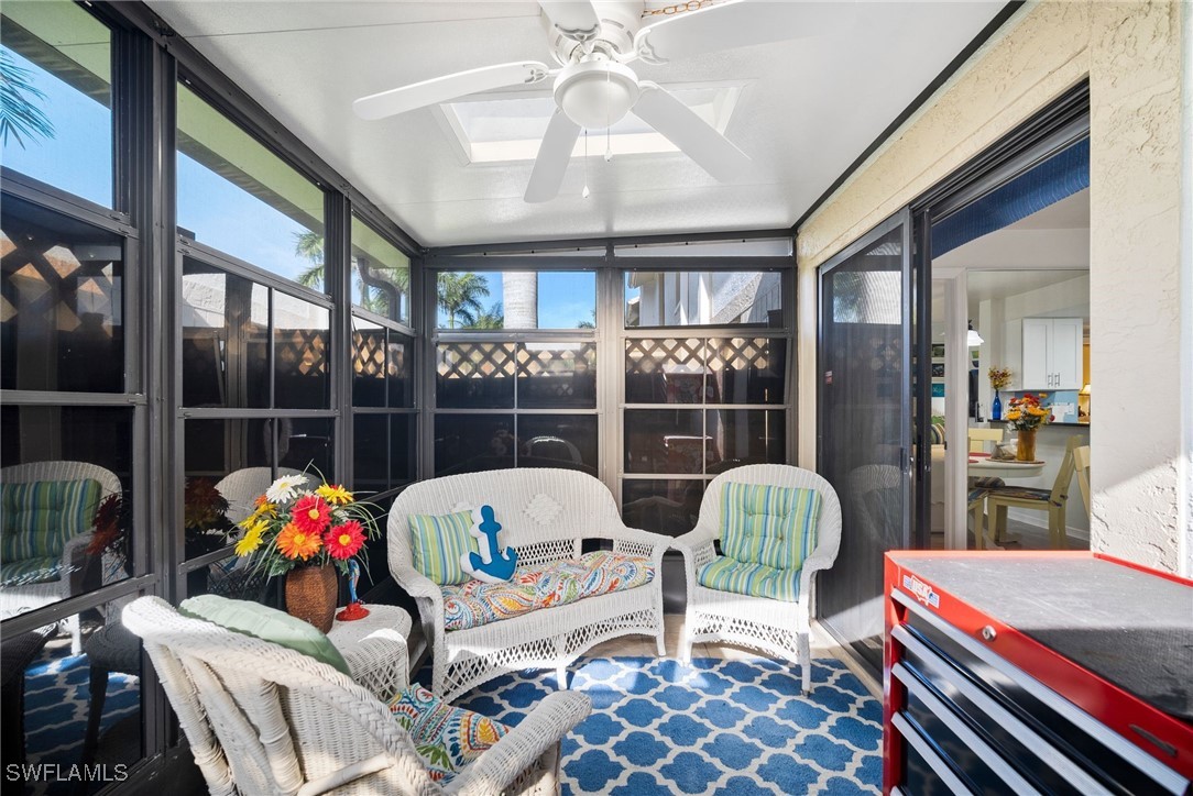 13241 Whitehaven Lane, Unit 803 Fort Myers, FL 33966 - Photo 20 of 22 a living room filled with furniture and a large window