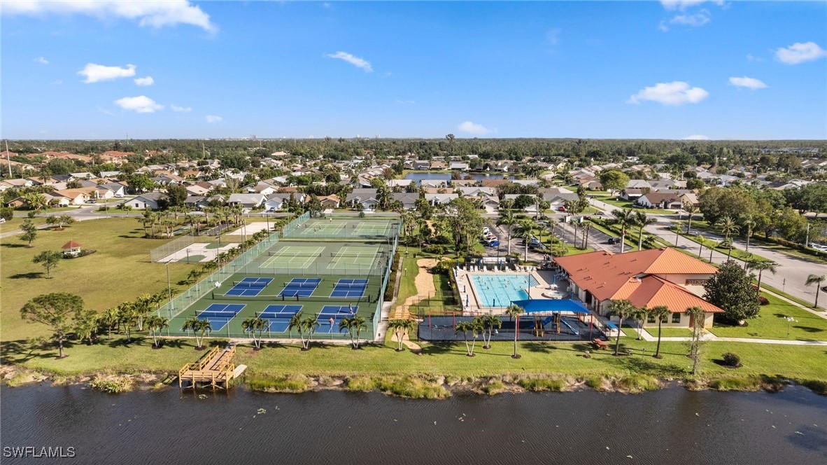 13241 Whitehaven Lane, Unit 803 Fort Myers, FL 33966 - Photo 2 of 22 an aerial view of residential houses with outdoor space
