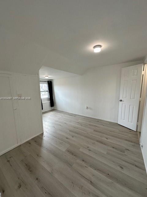 274 East 9th Street, Unit 4 Hialeah, FL 33010 - Photo 6 of 15 an empty room with wooden floor and windows