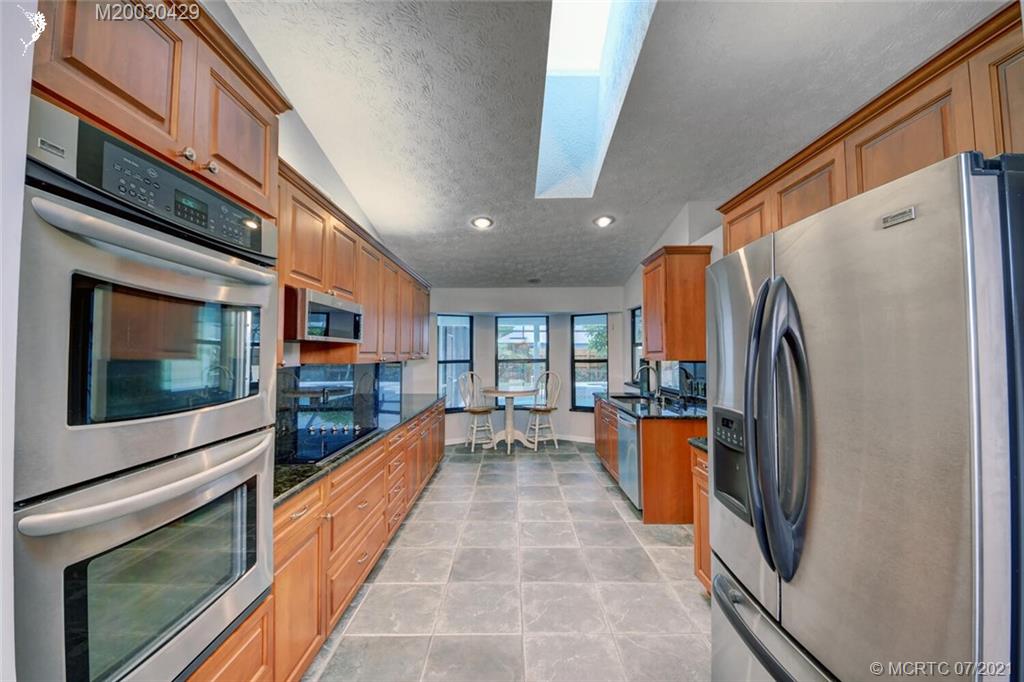 2126 Southeast Dolphin Road Port St. Lucie, FL 34952 - Photo 15 of 30 a view of a kitchen with a large window