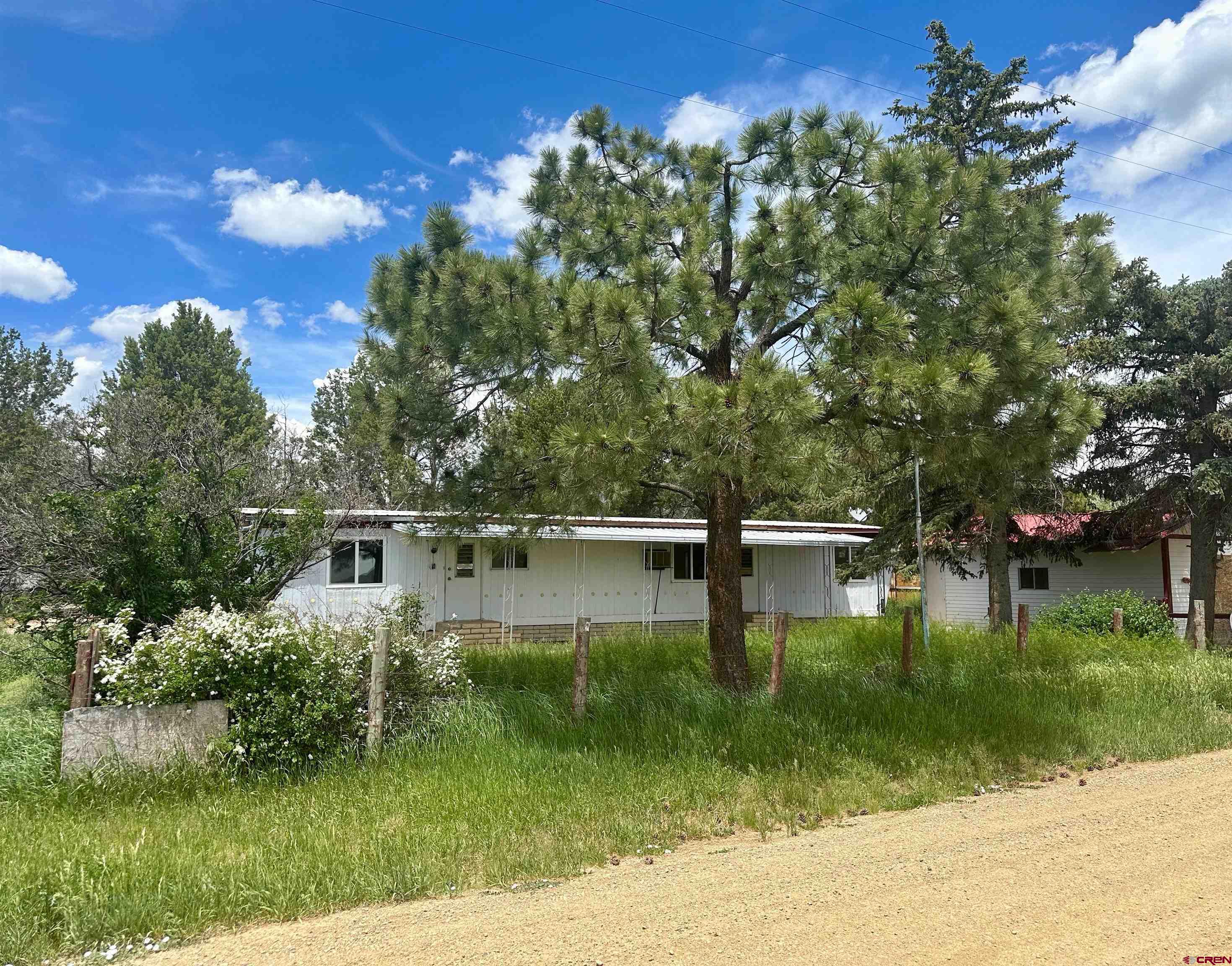a wooden house with river in front of it