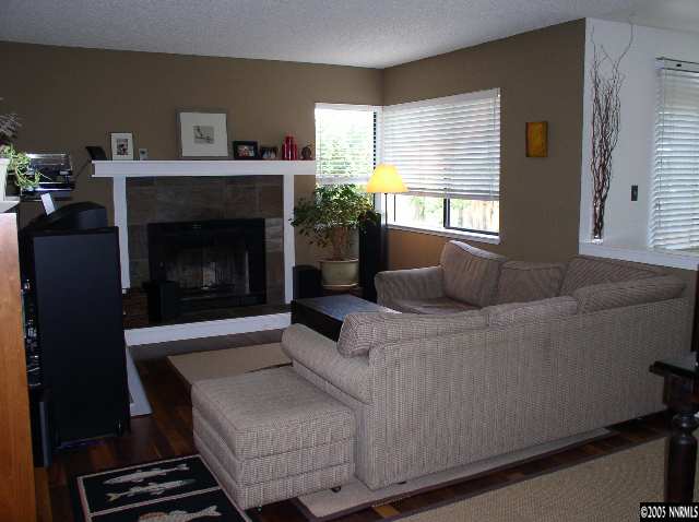 140 Riverhaven Place Reno, NV 89519 - Photo 2 of 6 a living room with furniture and a fireplace