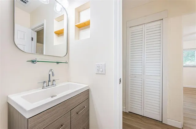 a bathroom with a sink and a mirror