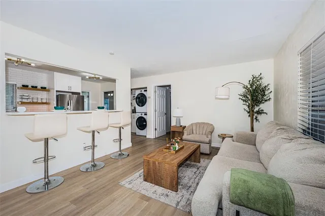 a living room with furniture and a table