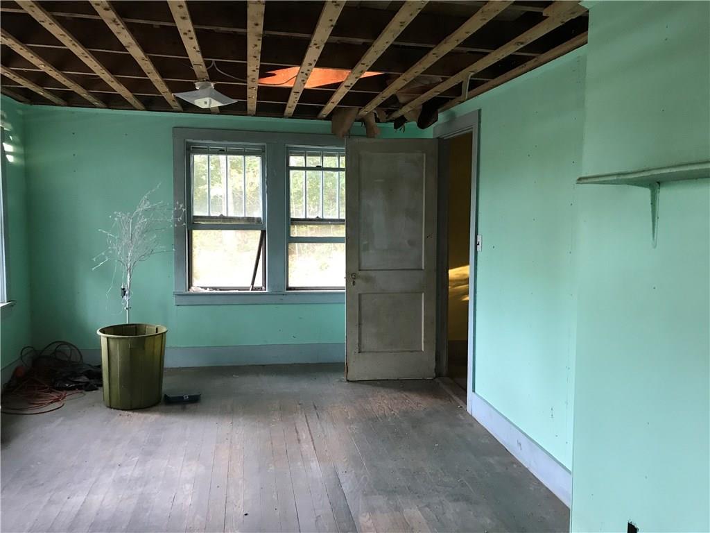 153 Back Narrows Road Boothbay, ME 04537 - Photo 5 of 22 Living room in front. Floors could...