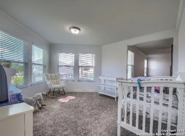 a living room with furniture window and wooden floor