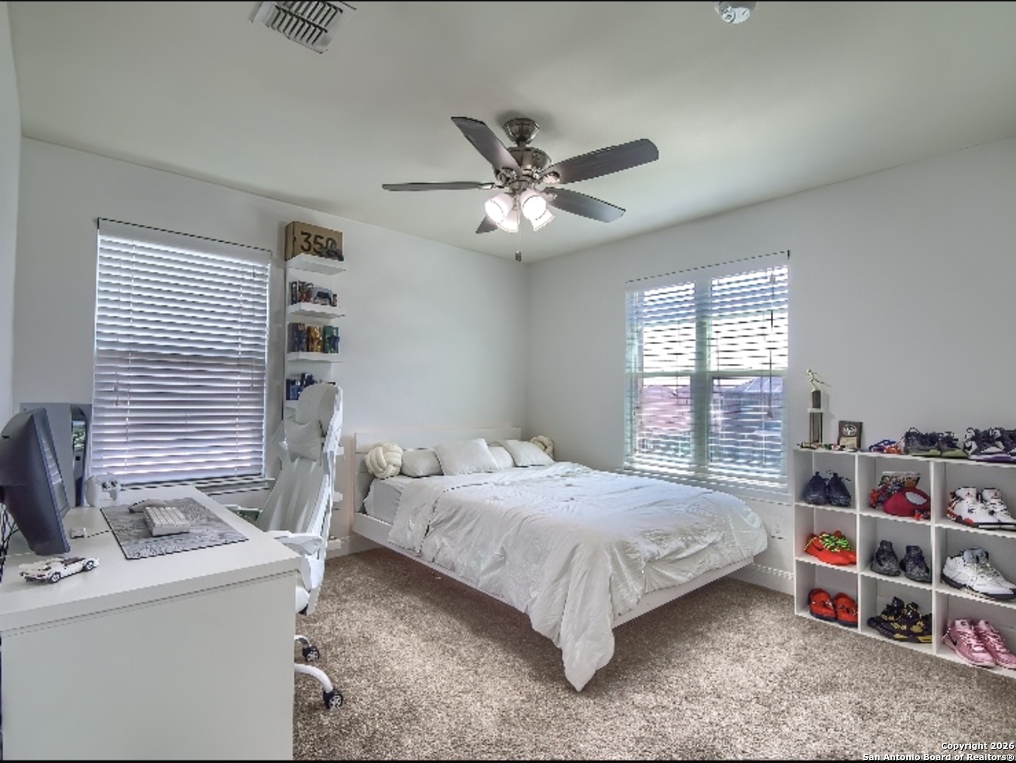 7566 Copper Cove Converse, TX 78109 - Photo 16 of 22 a bedroom with a bed furniture and a window