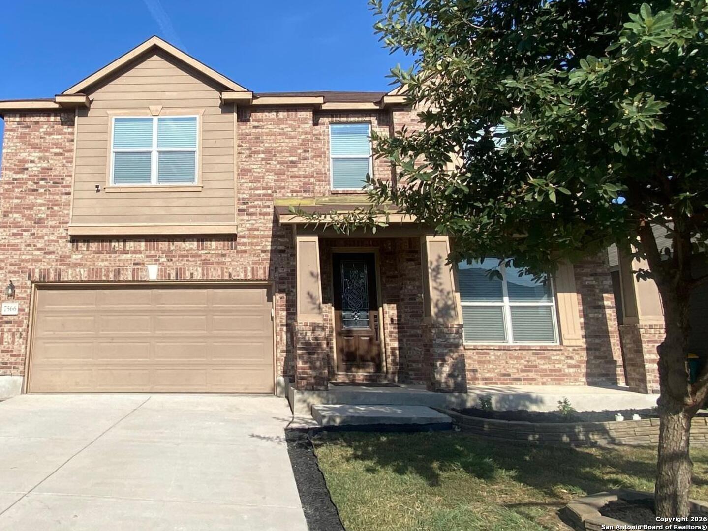 7566 Copper Cove Converse, TX 78109 - Photo 2 of 22 a front view of a house with garden