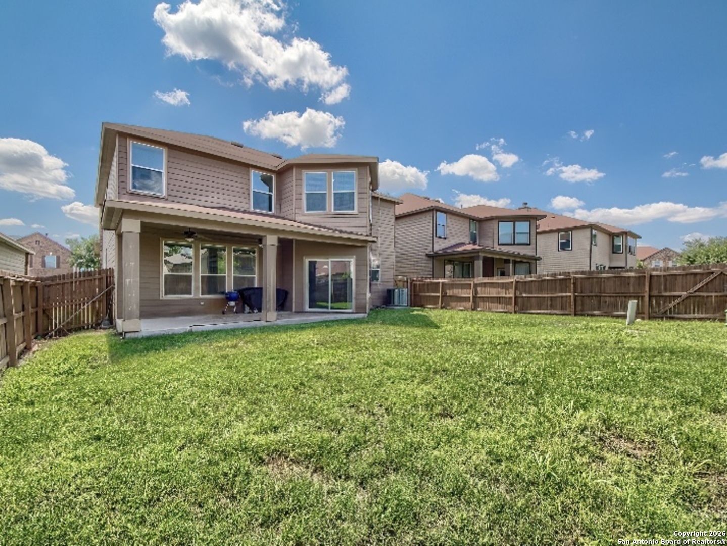 7566 Copper Cove Converse, TX 78109 - Photo 22 of 22 a view of a house with backyard and porch