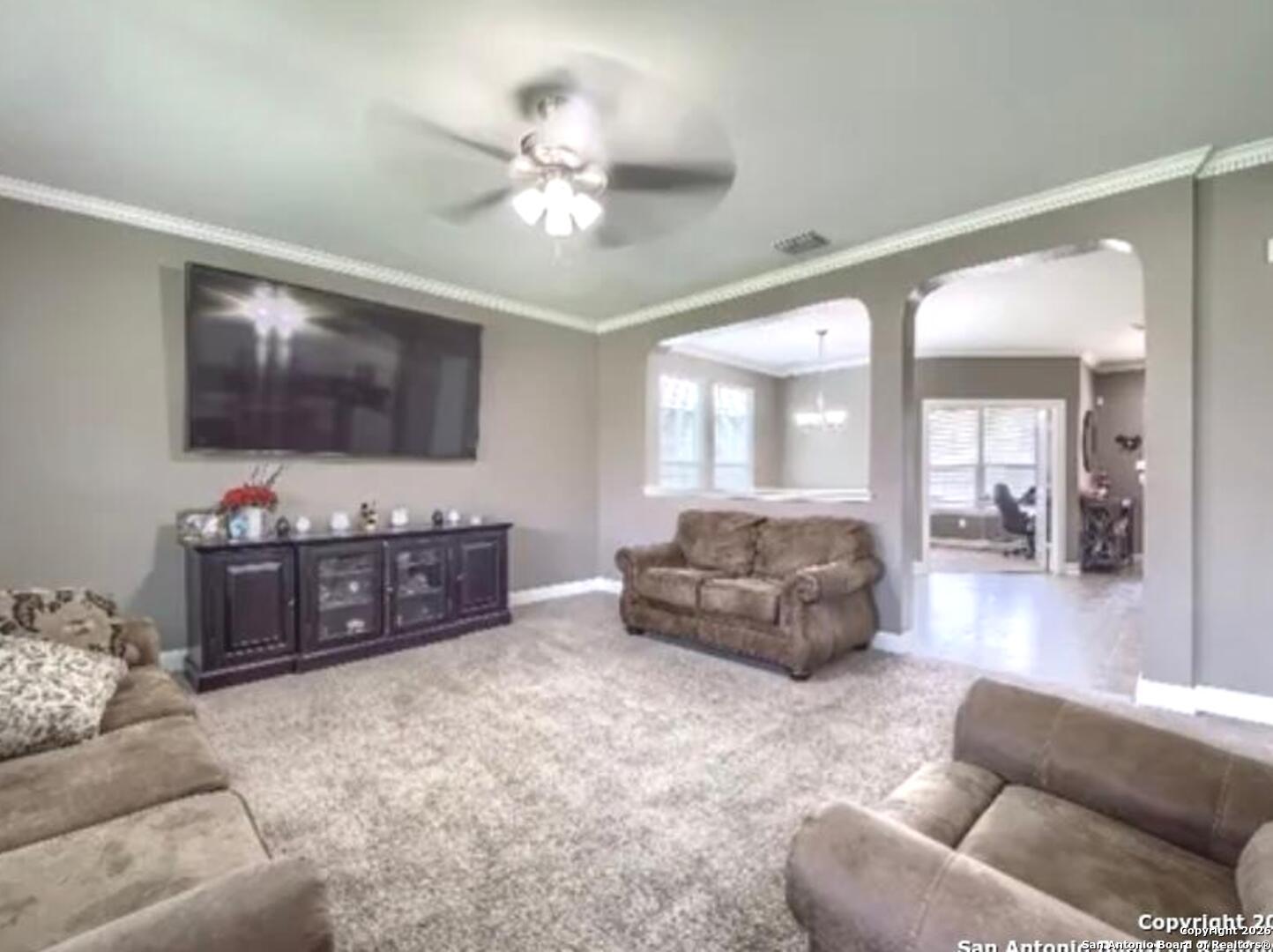 7566 Copper Cove Converse, TX 78109 - Photo 7 of 22 a living room with furniture and a flat screen tv