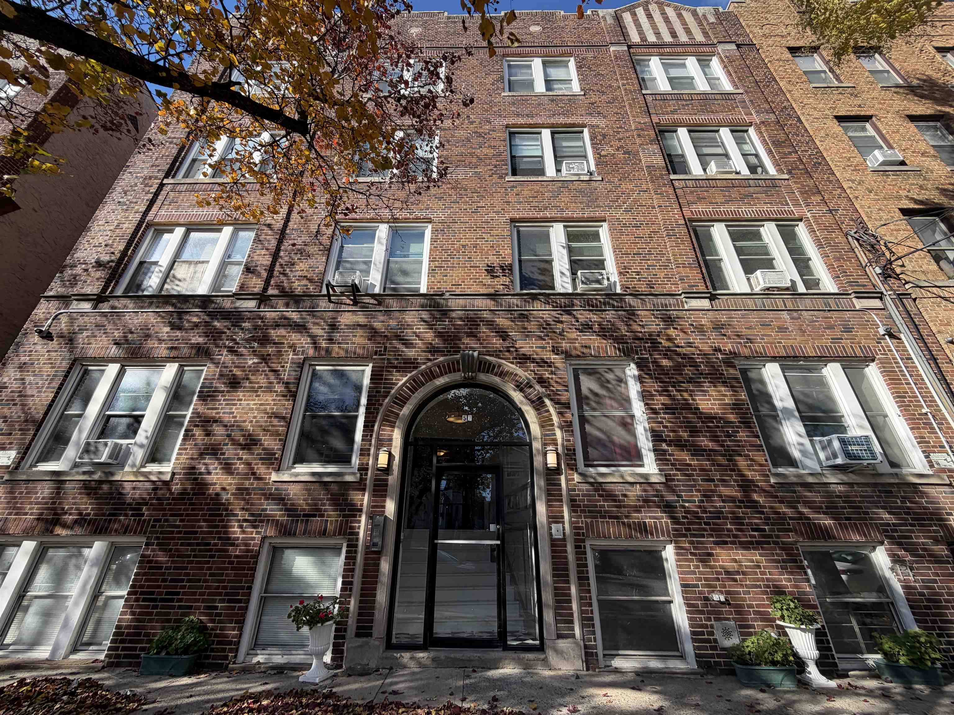 57 Corbin Avenue, Unit 4 Jersey City, NJ 07306 - Photo 1 of 8 front view of a building