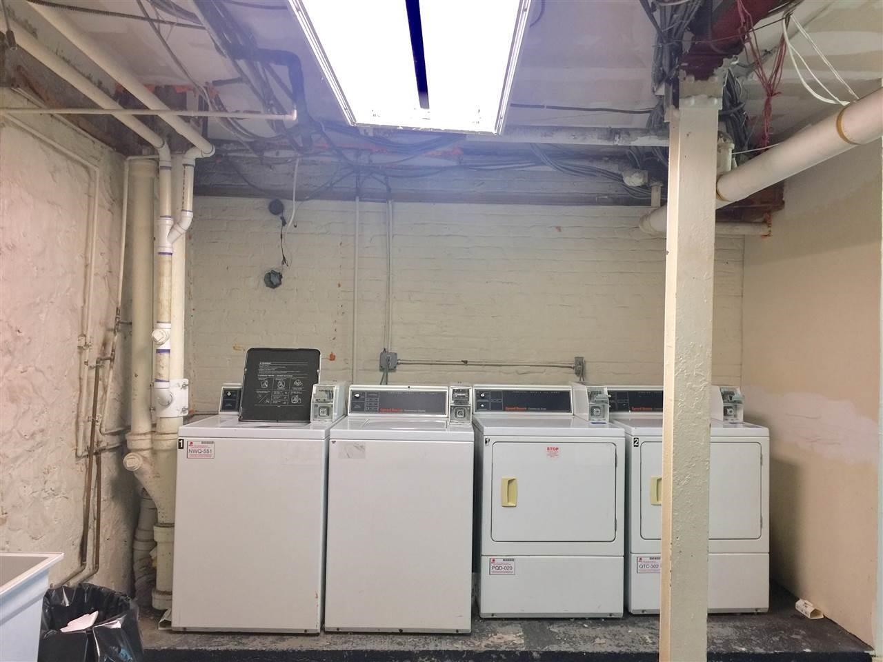 57 Corbin Avenue, Unit 4 Jersey City, NJ 07306 - Photo 8 of 8 a utility room with dryer and washer