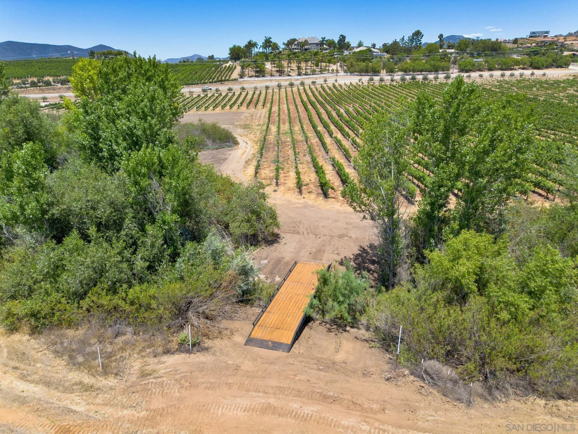 36051 East Benton Road, Unit 1 Temecula, CA 92592 - Photo 17 of 42 a view of a lake with a yard