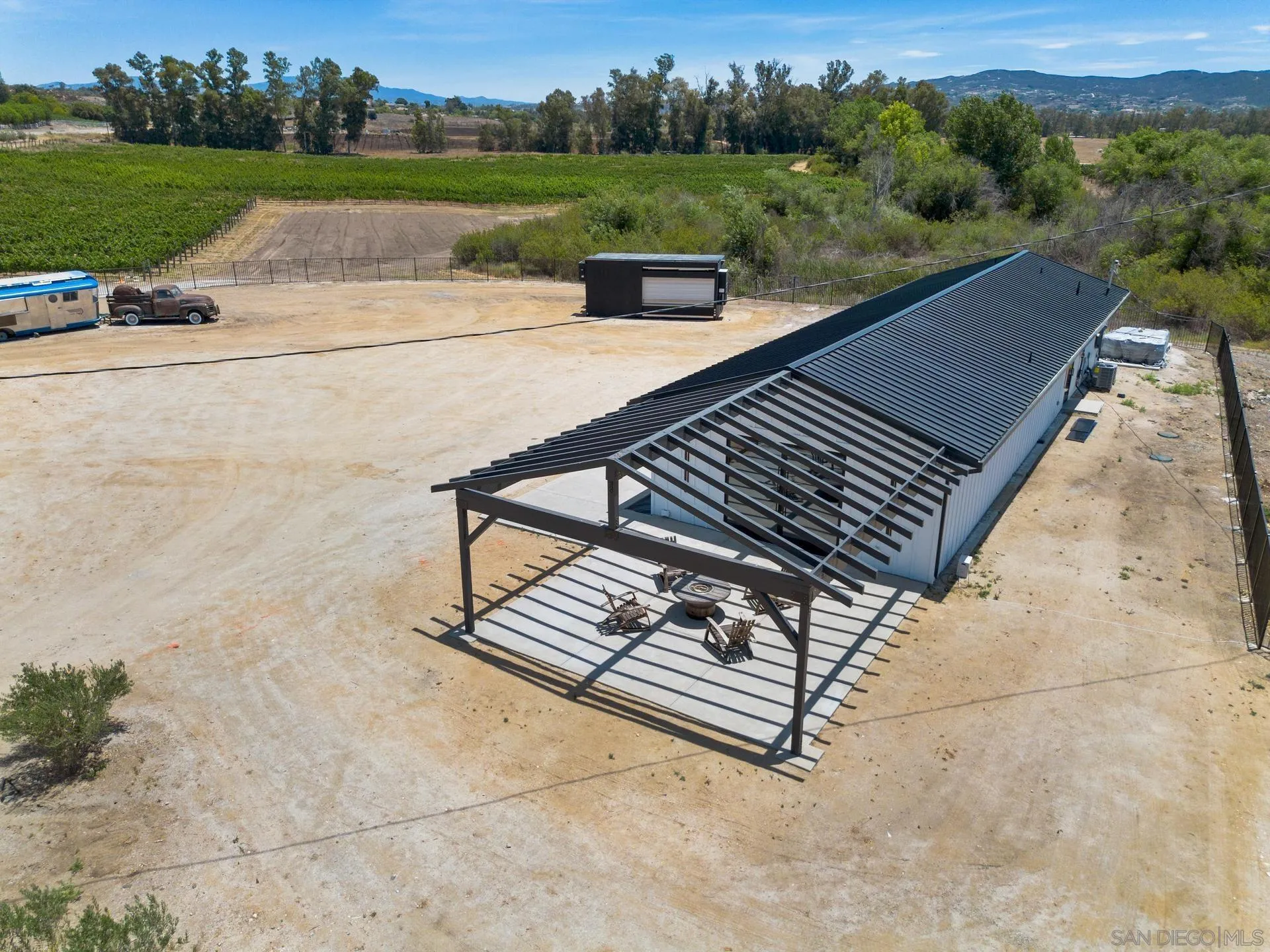 36051 East Benton Road, Unit 1 Temecula, CA 92592 - Photo 31 of 42 a view of a patio with a yard
