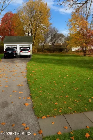 a view of street with parked cars