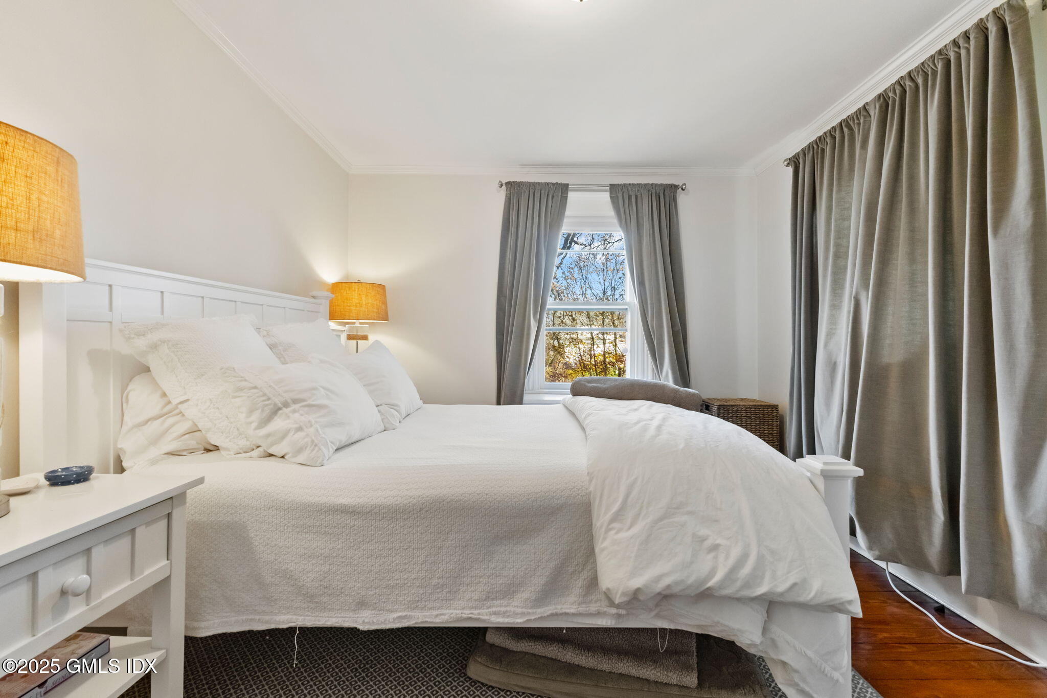 27 Sinawoy Road Cos Cob, CT 06807 - Photo 8 of 13 a bedroom with a bed and a window