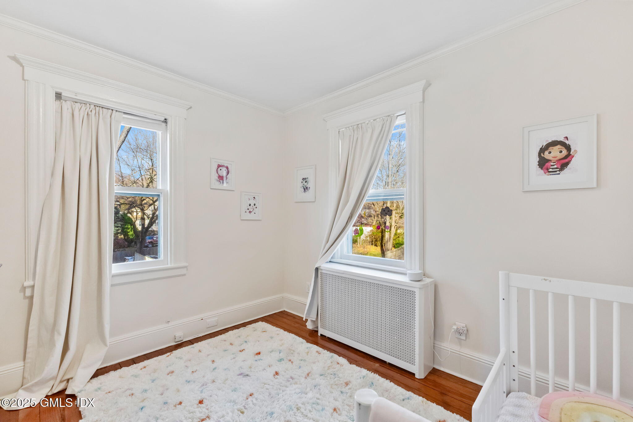 27 Sinawoy Road Cos Cob, CT 06807 - Photo 9 of 13 a view of a bedroom with a window and wooden floor