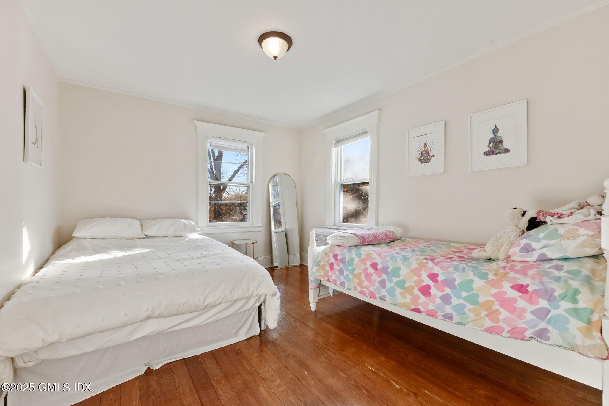 27 Sinawoy Road Cos Cob, CT 06807 - Photo 10 of 13 a bedroom with two beds and a painting on the wall
