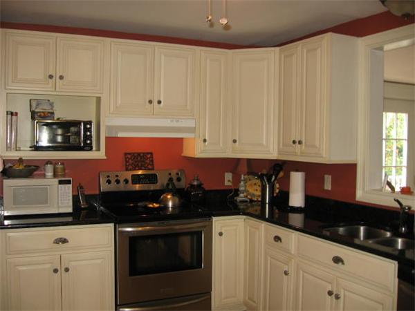6 Lyndale Road Worcester, MA 01606 - Photo 9 of 21 a kitchen with granite countertop white cabinets and black appliances