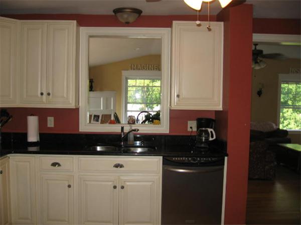 6 Lyndale Road Worcester, MA 01606 - Photo 10 of 21 a kitchen with granite countertop white cabinets and black appliances