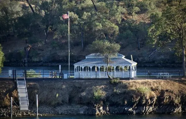 a view of house with outdoor space and sitting area