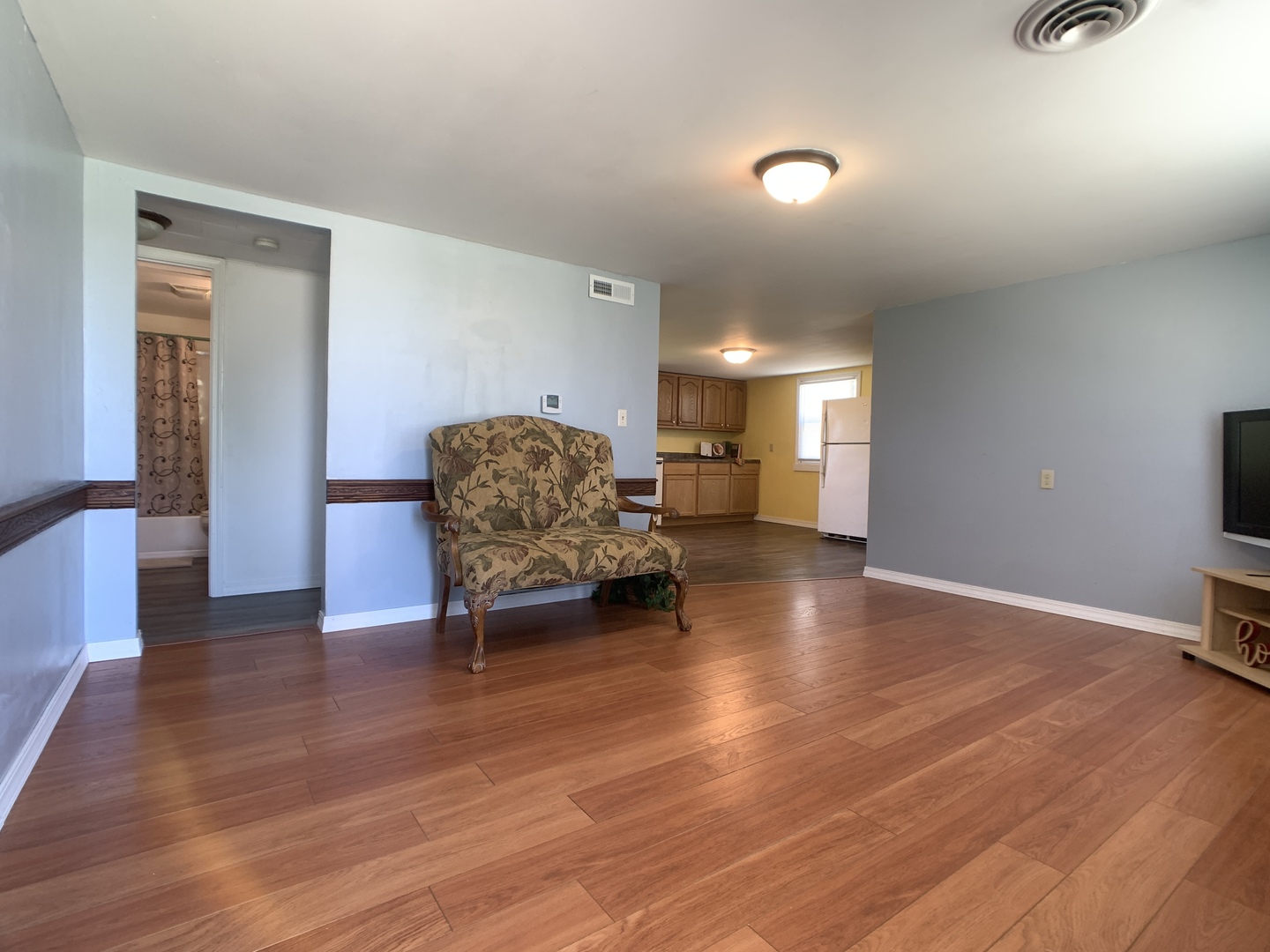 205 West 7th Street Spring Valley, IL 61362 - Photo 12 of 34 a living room with furniture and a wooden floor