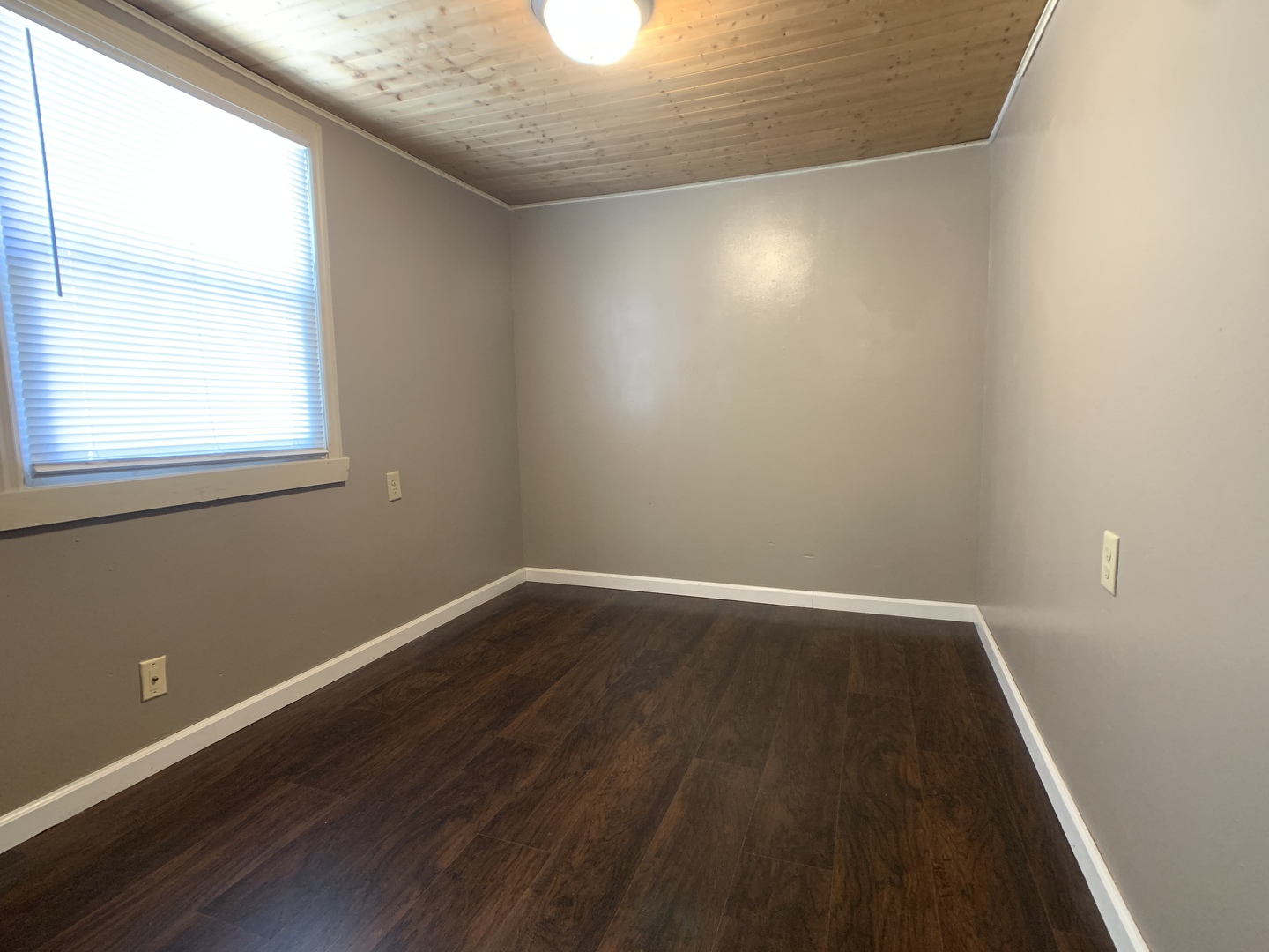 205 West 7th Street Spring Valley, IL 61362 - Photo 24 of 34 an empty room with wooden floor and windows
