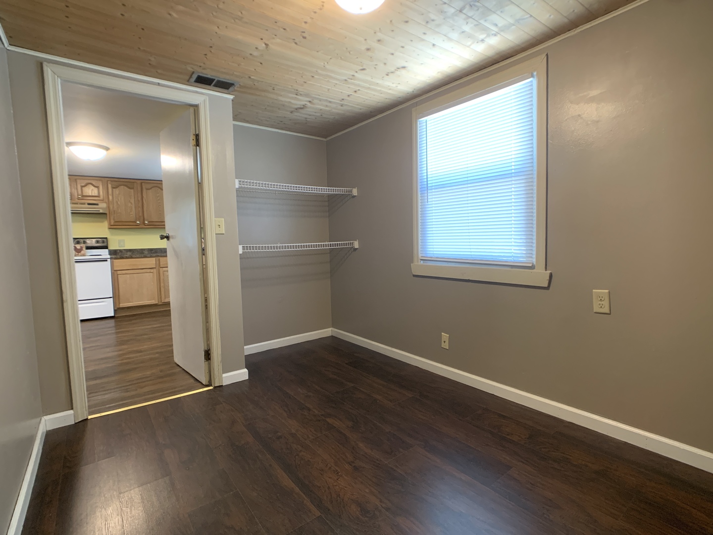 205 West 7th Street Spring Valley, IL 61362 - Photo 25 of 34 an empty room with wooden floor mirror and windows