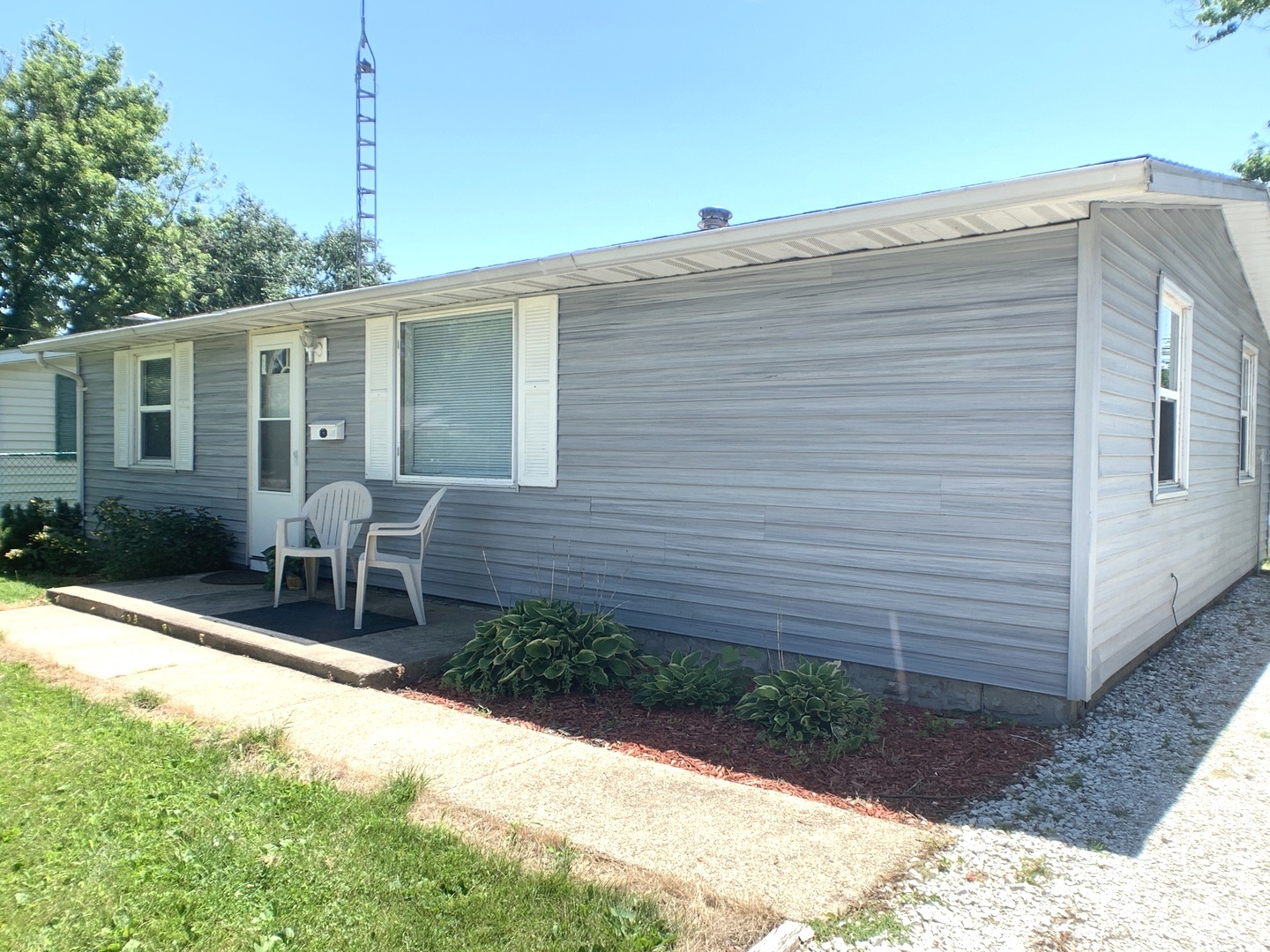 205 West 7th Street Spring Valley, IL 61362 - Photo 3 of 34 a wooden bench sitting in front of a house