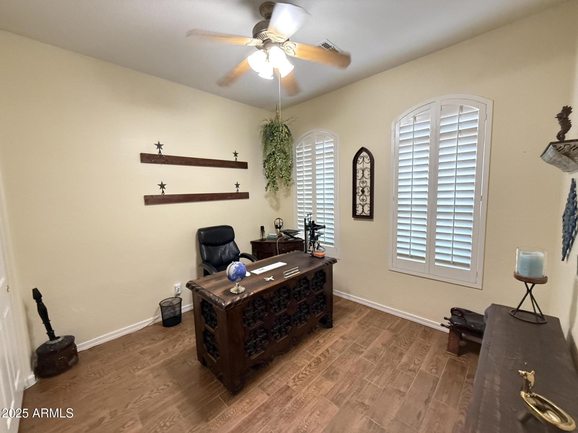 2245 West Clearview Trail Phoenix, AZ 85086 - Photo 12 of 76 a living room with furniture and a window