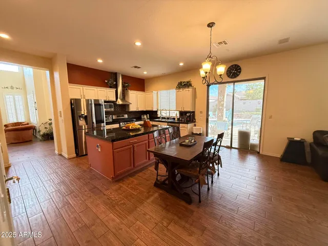 a stove top oven sitting inside of a kitchen