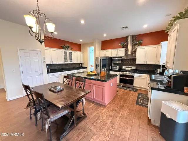 a utility room with sink dryer and washer