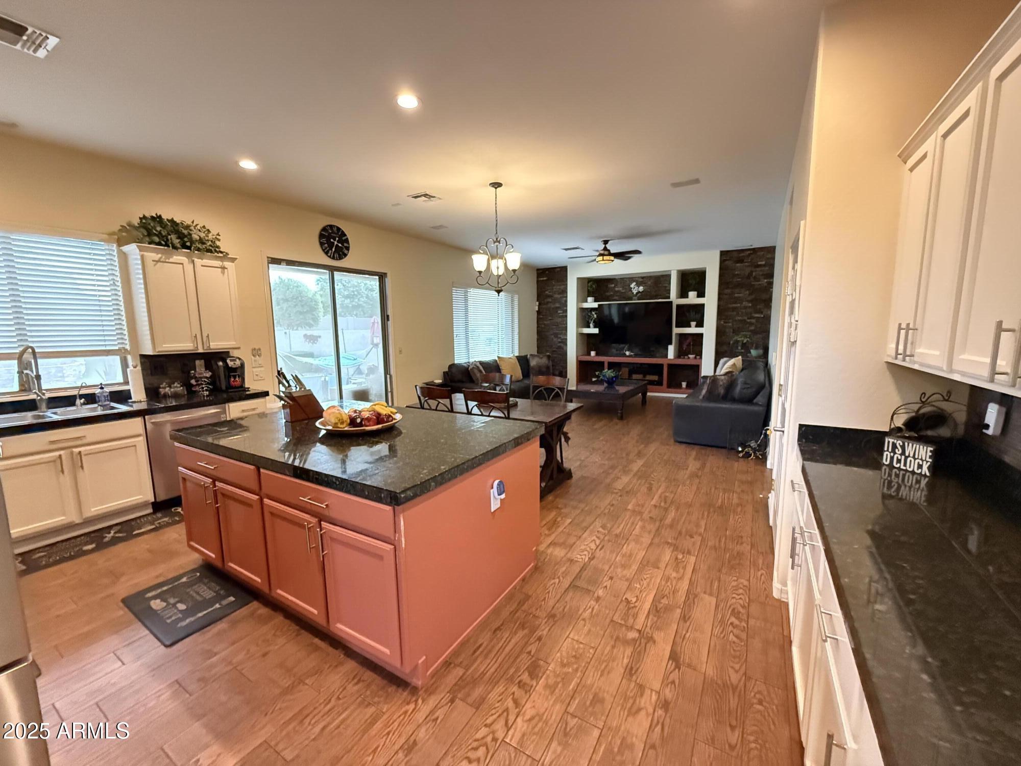 2245 West Clearview Trail Phoenix, AZ 85086 - Photo 25 of 76 a kitchen with stainless steel appliances granite countertop a stove and a sink