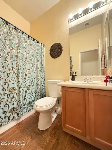 a view of a livingroom with workspace and a window