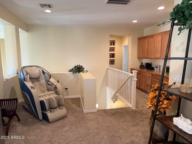 a bedroom with a bed dresser and a window