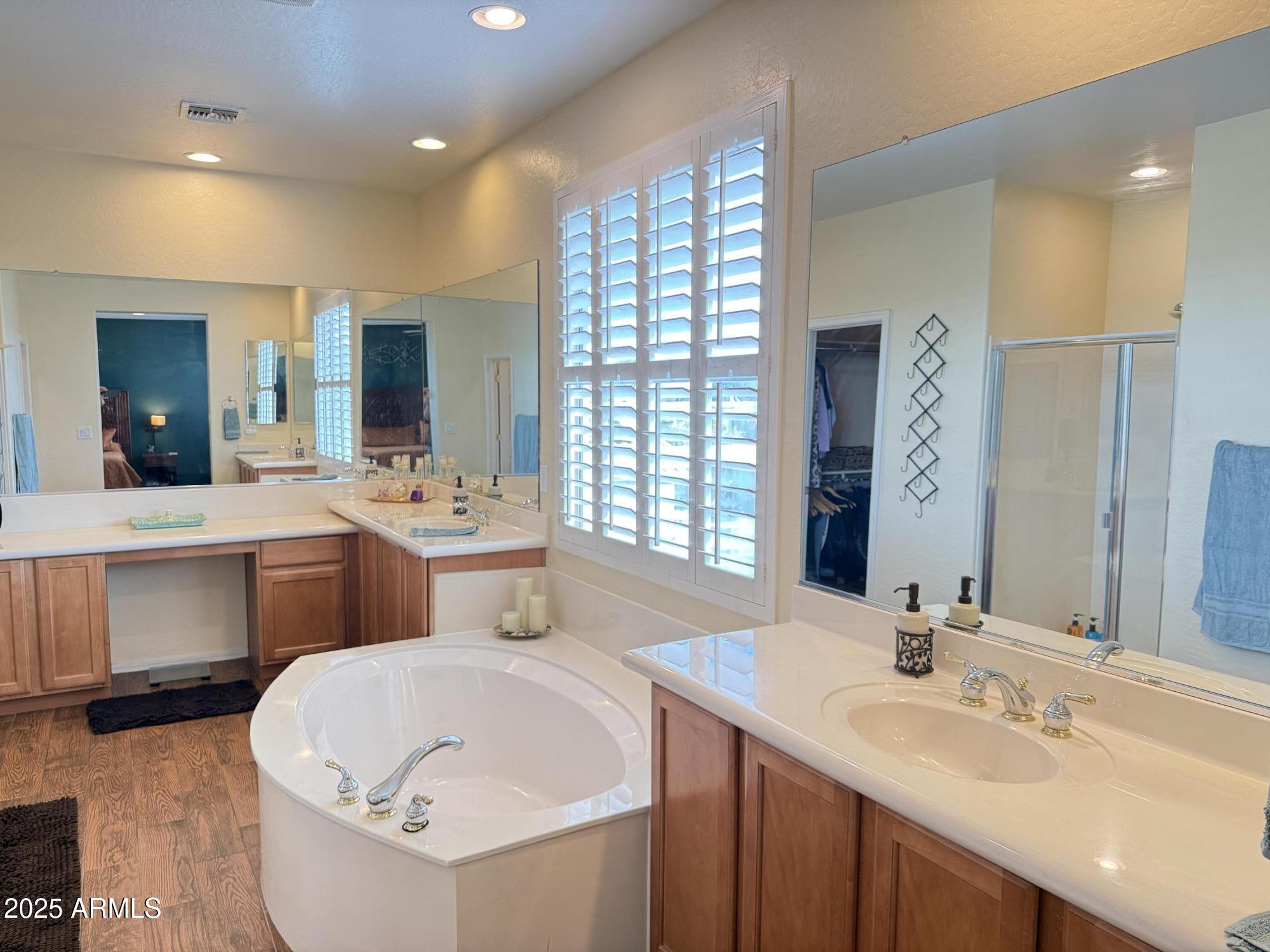 2245 West Clearview Trail Phoenix, AZ 85086 - Photo 46 of 76 a en suite bathroom with a double vanity sink and a large mirror