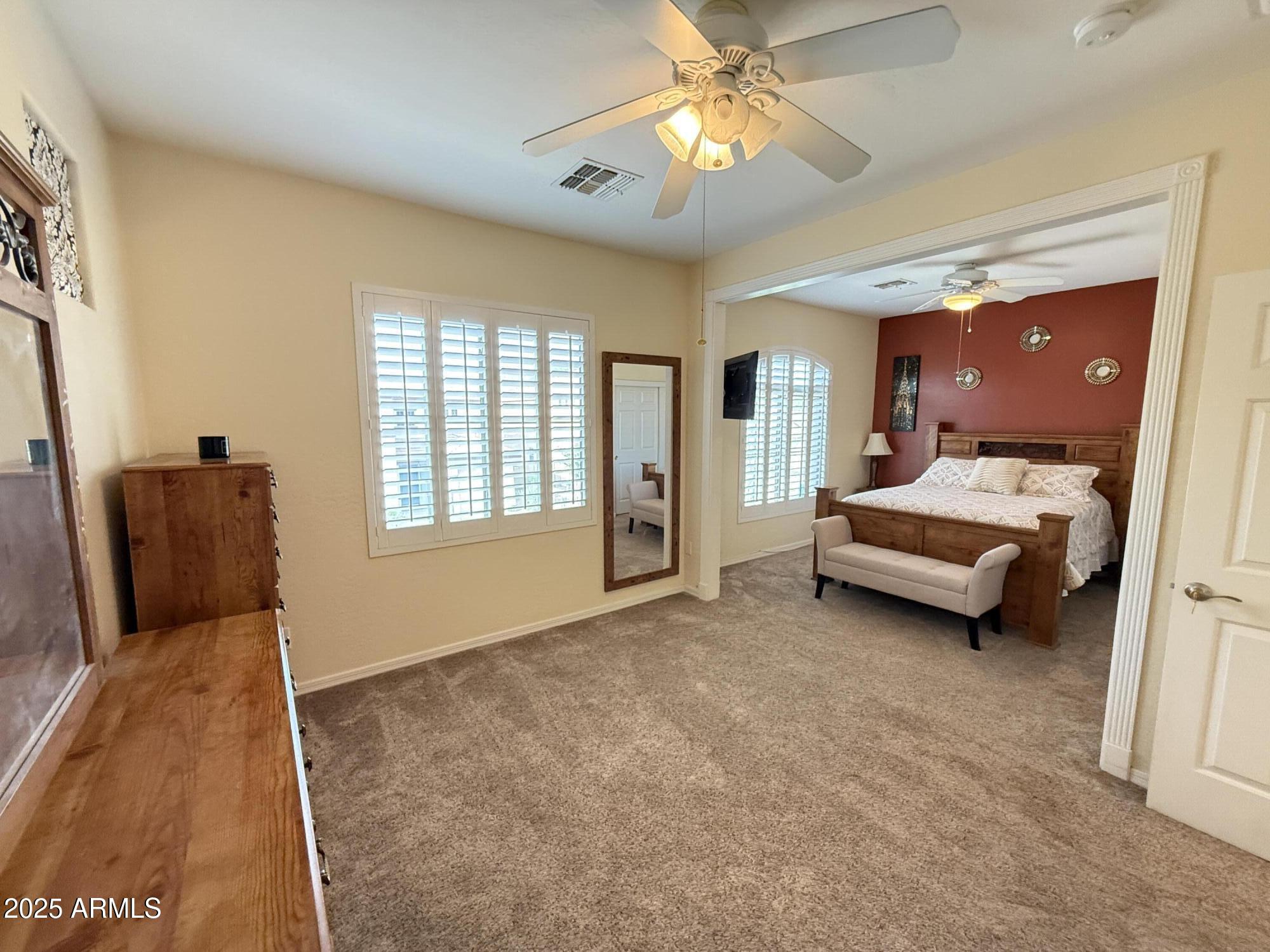 2245 West Clearview Trail Phoenix, AZ 85086 - Photo 48 of 76 a bedroom with a bed dresser and a window