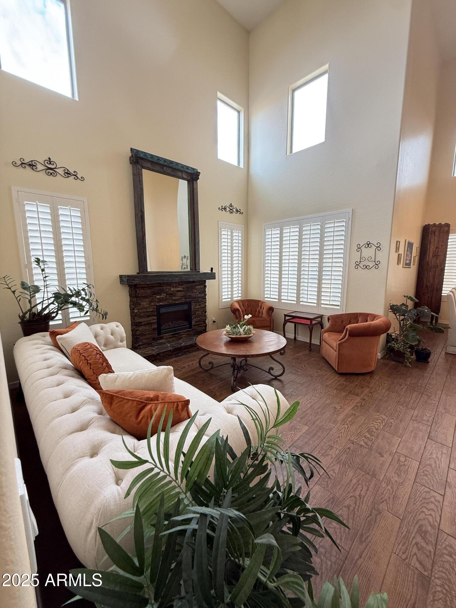 2245 West Clearview Trail Phoenix, AZ 85086 - Photo 5 of 76 a living room with furniture fireplace and a window