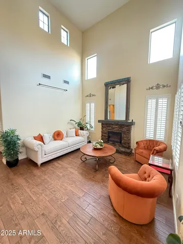 a living room with furniture and a potted plant
