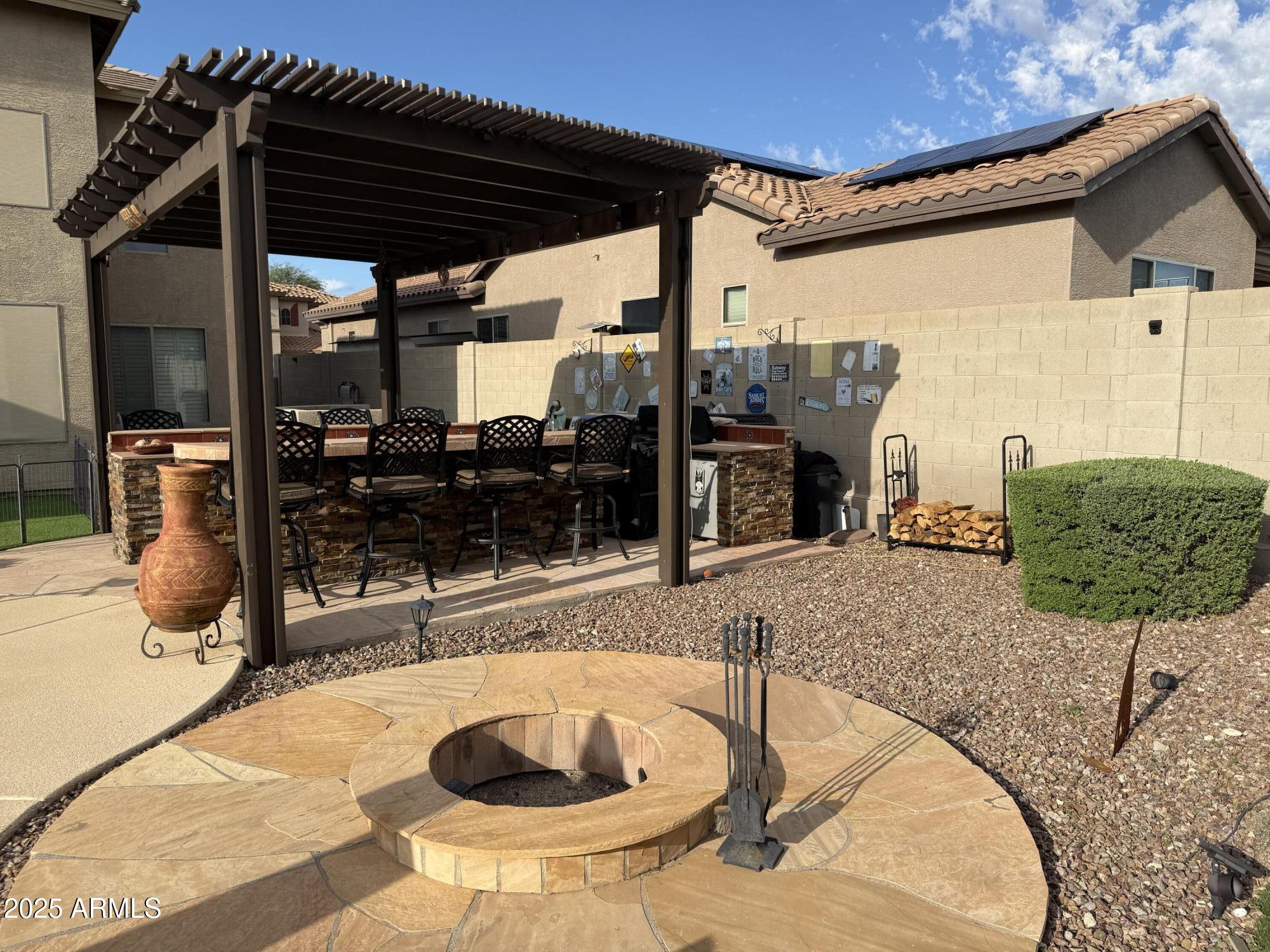 2245 West Clearview Trail Phoenix, AZ 85086 - Photo 65 of 76 a view of a patio with table and chairs potted plants