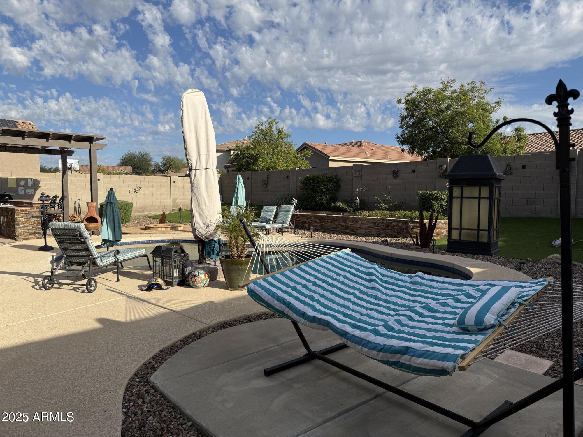 2245 West Clearview Trail Phoenix, AZ 85086 - Photo 69 of 76 a view of outdoor space with seating area and trees