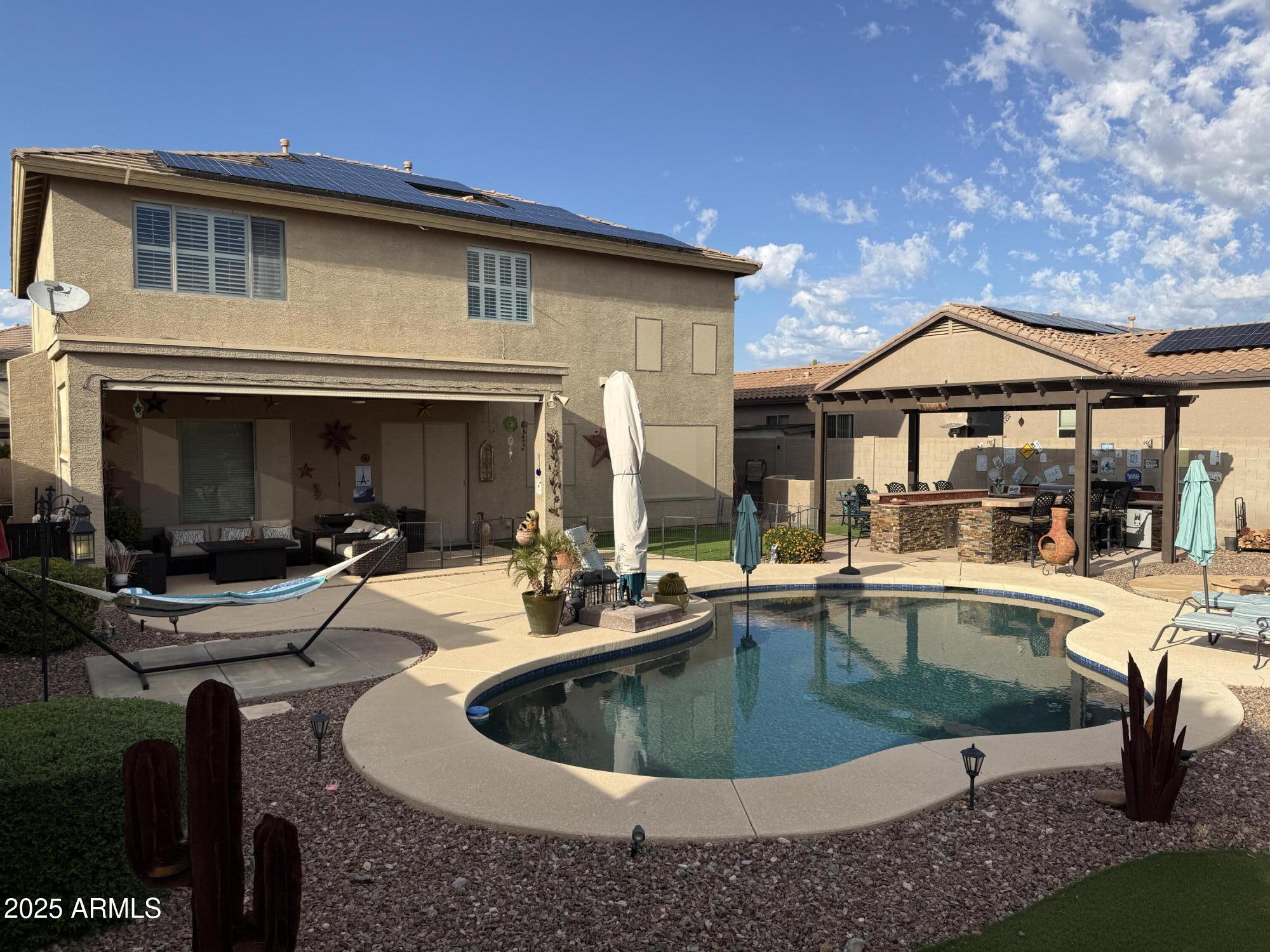 2245 West Clearview Trail Phoenix, AZ 85086 - Photo 74 of 76 a view of house and outdoor space with swimming pool