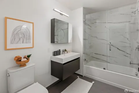 a bathroom with a toilet a sink and a bathtub