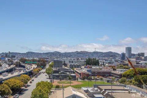 an aerial view of residential houses with outdoor space and river