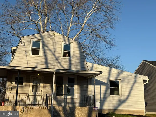 a front view of a house with glass windows