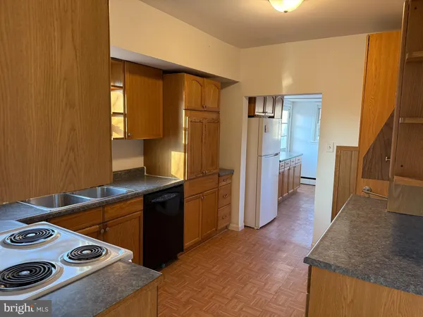 a kitchen with a stove and a refrigerator