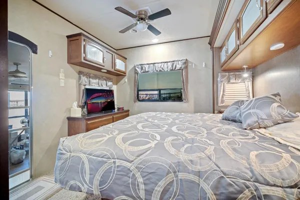 a bedroom with a bed and window