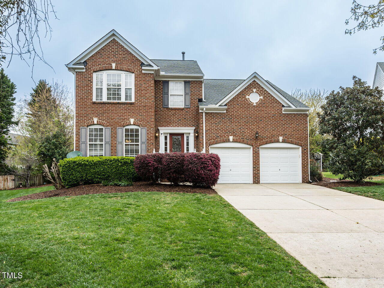 214 Competition Road Raleigh, NC 27603 - Photo 1 of 32 a front view of a house with a garden and yard